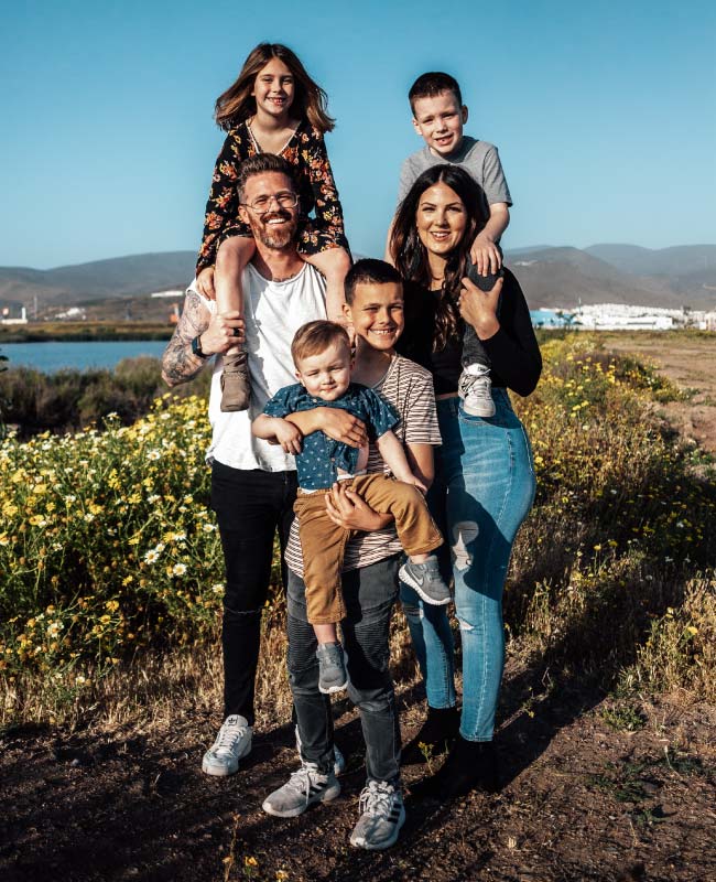 Young family posing for picture